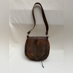 Vintage 70’s hand tooled hand screwed leather bag.